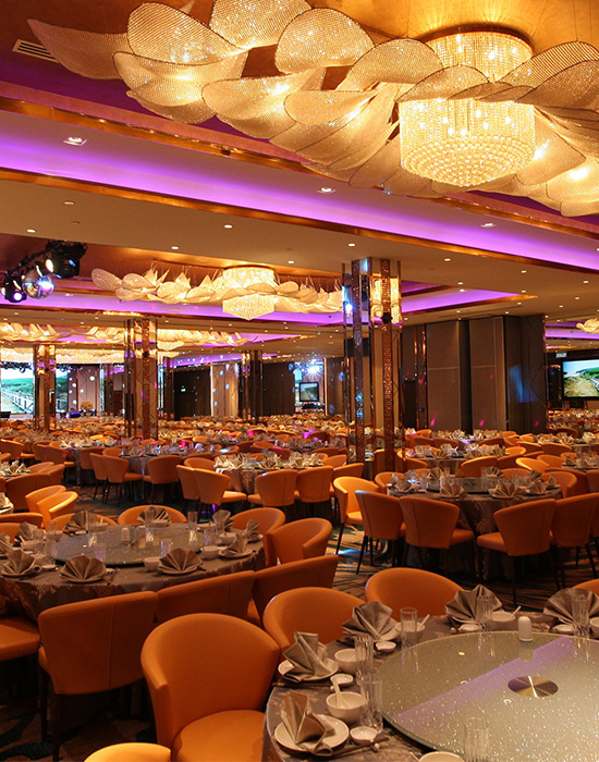 Layered decorative and theatrical lighting inside OUG Jade