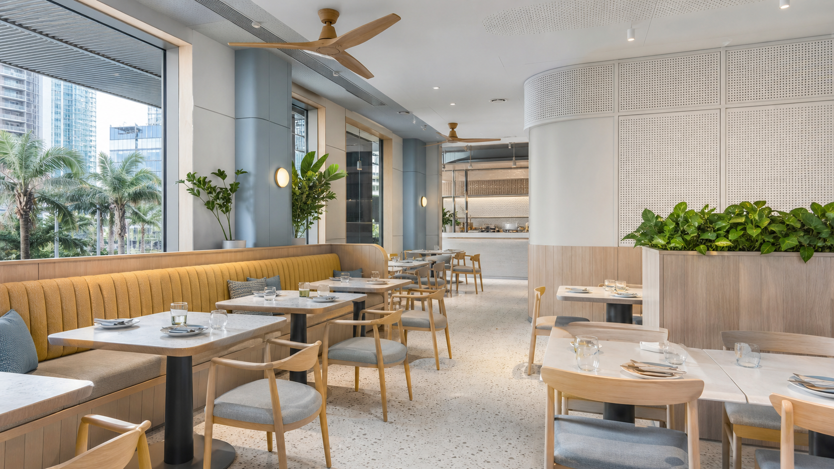 Light contemporary restaurant using flexible seating, acoustic surfaces and tropical daylight