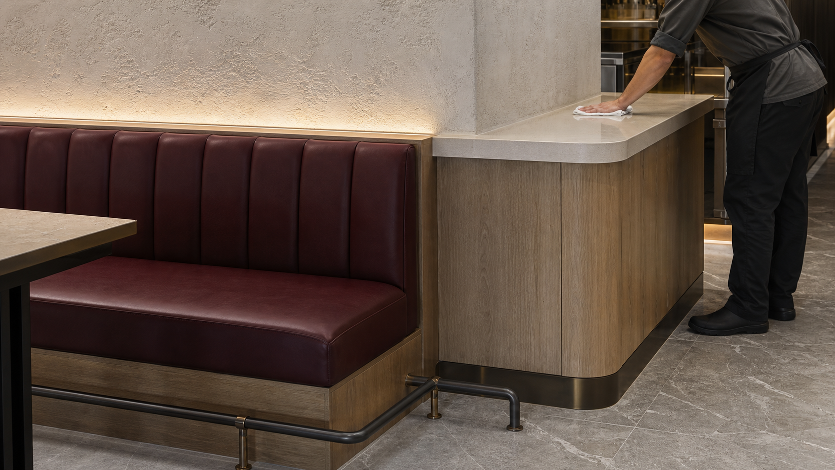 Restaurant material junction showing washable wall, durable joinery, upholstery and floor finishes